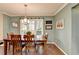 Dining room with hardwood floors, natural light and chandelier at 3160 Bailey Cove Ct, Dacula, GA 30019