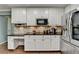 Modern kitchen featuring stainless steel appliances, granite countertops, and ample storage space at 3160 Bailey Cove Ct, Dacula, GA 30019