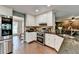 Modern kitchen featuring stainless steel appliances, white cabinets, and seamless flow into living spaces at 3160 Bailey Cove Ct, Dacula, GA 30019