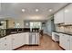 Open kitchen layout with stainless steel dishwasher, granite countertops and adjacent dining area at 3160 Bailey Cove Ct, Dacula, GA 30019