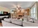 Spacious living room with cozy brick fireplace, large windows and neutral decor at 3160 Bailey Cove Ct, Dacula, GA 30019