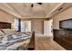 Relax in this spacious main bedroom featuring ample space, natural light, and ensuite bath access at 3160 Bailey Cove Ct, Dacula, GA 30019