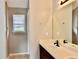Bathroom featuring a wide vanity with a sink, a window, and neutral wall paint at 5635 Cedar Pass, Fairburn, GA 30213