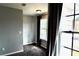 Cozy bedroom with large window, gray walls, and carpeting at 5635 Cedar Pass, Fairburn, GA 30213