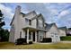 Beautiful two-story home featuring stone accents and a charming front yard at 5635 Cedar Pass, Fairburn, GA 30213
