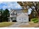 Charming two-story home featuring stone accents and a two-car garage at 5635 Cedar Pass, Fairburn, GA 30213