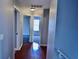 Hallway with wood flooring that leads to bedrooms with carpet at 5635 Cedar Pass, Fairburn, GA 30213