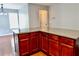 Kitchen island with dark cabinets and granite countertops at 5635 Cedar Pass, Fairburn, GA 30213