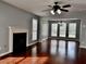 Spacious living room with gleaming hardwood floors and a cozy fireplace at 5635 Cedar Pass, Fairburn, GA 30213