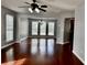 Open-concept living area with hardwood floors and ample natural light at 5635 Cedar Pass, Fairburn, GA 30213