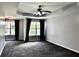 Main bedroom boasts trey ceilings, ceiling fan, and large windows at 5635 Cedar Pass, Fairburn, GA 30213