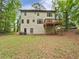 Large backyard view with a wooden deck, perfect for outdoor gatherings at 7155 Homestead Rd, Rex, GA 30273