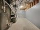 Unfinished basement showcasing concrete floors and exposed insulation, perfect for customization at 7155 Homestead Rd, Rex, GA 30273