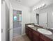 Bathroom with double sink vanity, granite countertops and bright natural light at 7155 Homestead Rd, Rex, GA 30273