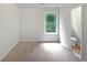 Carpeted bedroom with neutral walls, window and natural light at 7155 Homestead Rd, Rex, GA 30273