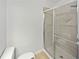This is a shot of the tile shower with sliding glass doors at 7155 Homestead Rd, Rex, GA 30273