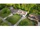 Aerial view of a beautifully landscaped suburban home with lush green lawns and mature trees at 917 Gaylemont Cir, Decatur, GA 30033