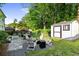 Backyard is great for entertaining; seating around fire pit, patio, and shed at 917 Gaylemont Cir, Decatur, GA 30033