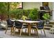 Backyard featuring wooden table, six chairs, and BBQ grill at 917 Gaylemont Cir, Decatur, GA 30033