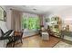 Sitting area with chair, ottoman, window view, keyboard, and hardwood flooring at 917 Gaylemont Cir, Decatur, GA 30033