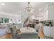 Elegant dining area with a marble table, comfortable seating, and an open layout with the kitchen at 917 Gaylemont Cir, Decatur, GA 30033