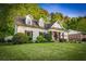 Beautiful home with white brick, dark trim, and a well-manicured lawn at 917 Gaylemont Cir, Decatur, GA 30033