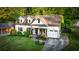 Charming white brick home featuring dormer windows and a well-manicured front yard at 917 Gaylemont Cir, Decatur, GA 30033