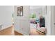 Bright hallway with hardwood floors leading to a playroom with stylish decor at 917 Gaylemont Cir, Decatur, GA 30033
