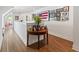 Upstairs hallway featuring a picture gallery wall and hardwood floors at 917 Gaylemont Cir, Decatur, GA 30033