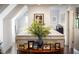 Bright hallway with lovely vase of greenery and framed photos at 917 Gaylemont Cir, Decatur, GA 30033