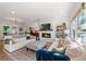 Inviting living room with natural light, a brick fireplace, and views of the backyard at 917 Gaylemont Cir, Decatur, GA 30033
