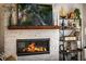 Inviting living room with stone fireplace, wooden mantle, and decorative shelving at 917 Gaylemont Cir, Decatur, GA 30033