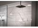 Luxurious shower featuring large marble-style tile and a modern shower head at 917 Gaylemont Cir, Decatur, GA 30033