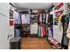 Organized walk-in closet featuring custom shelving, drawers, hanging racks, and hardwood floors at 917 Gaylemont Cir, Decatur, GA 30033