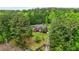 Two story brick home with lawn and mature trees offers a private, wooded retreat at 2498 Highway 212, Covington, GA 30016