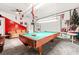 Finished basement with a pool table, bar stools, and recreational space at 2498 Highway 212, Covington, GA 30016