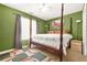 Bedroom features a four-poster bed and natural light at 2498 Highway 212, Covington, GA 30016