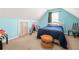 Cozy bedroom with blue walls, a window, a bed and carpeted flooring at 2498 Highway 212, Covington, GA 30016
