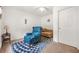 Bedroom with comfortable seating, featuring carpeted flooring, light walls and ceiling fan at 2498 Highway 212, Covington, GA 30016