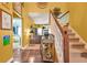Inviting foyer features hardwood floors, staircase, and decorative console table at 2498 Highway 212, Covington, GA 30016