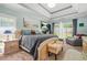 Spacious bedroom with tray ceiling, neutral color palette, and ample natural light at 2498 Highway 212, Covington, GA 30016