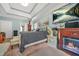 Large bedroom with tray ceiling, fireplace, television, and accent lighting at 2498 Highway 212, Covington, GA 30016