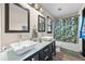 Bright bathroom with double sinks, modern vanity, and stylish shower curtain at 255 Deer Run Rd, Ellenwood, GA 30294