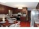 Traditional kitchen with dark cabinets and stainless steel appliances at 255 Deer Run Rd, Ellenwood, GA 30294