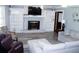 Comfortable living room featuring a cozy fireplace and modern gray flooring at 255 Deer Run Rd, Ellenwood, GA 30294