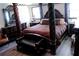 Opulent main bedroom showcasing a four-poster bed and elegant furnishings at 255 Deer Run Rd, Ellenwood, GA 30294