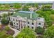 Aerial view of historic building with a green roof, columns, and surrounding trees and landscape at 424 Melrose Ave, Decatur, GA 30030