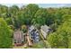 Stunning aerial view of neighborhood homes nestled among lush, mature trees at 424 Melrose Ave, Decatur, GA 30030