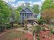 Picturesque backyard with a patio, well-kept garden, stone walkways and a fenced perimeter at 424 Melrose Ave, Decatur, GA 30030