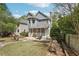 Spacious backyard with patio, screened porch, fire pit, and well-maintained lawn at 424 Melrose Ave, Decatur, GA 30030
